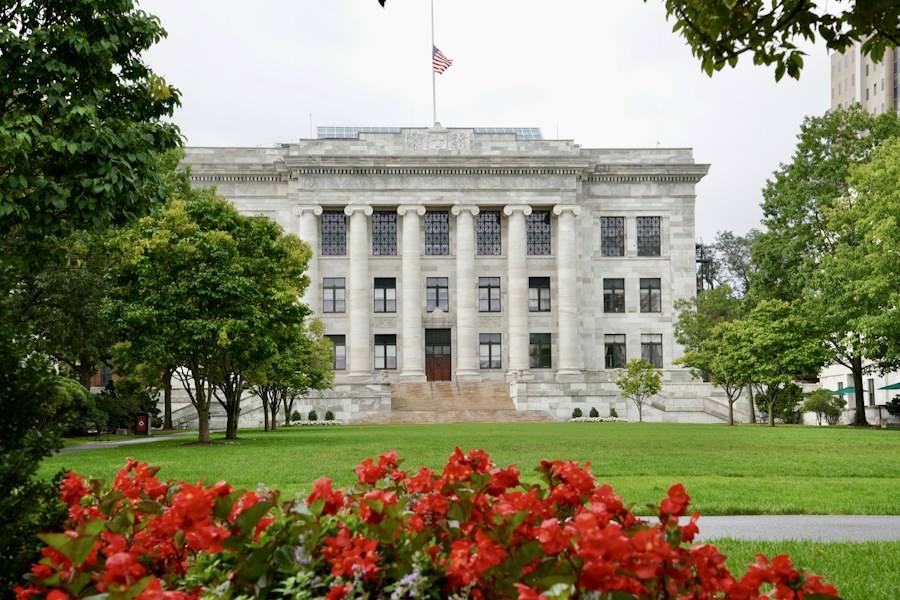 US campus building flying the American flag