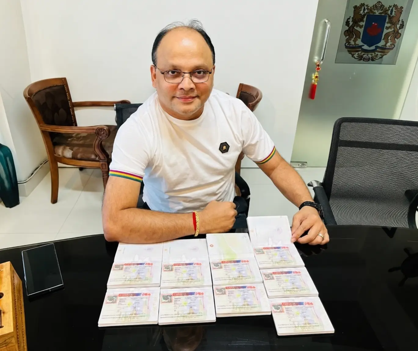 Consultant holding four Canadian visa approvals received in one day